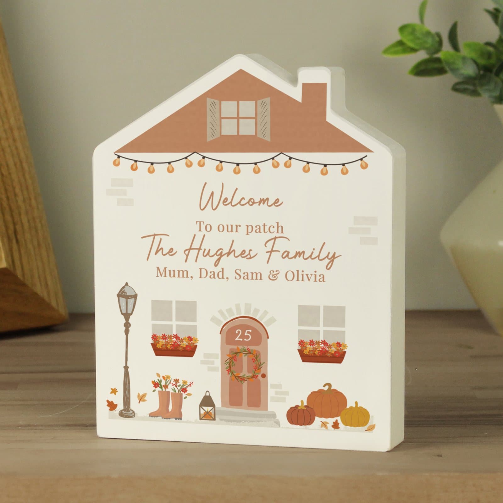 Autumnal wooden house ornament with personalised lines and a door number