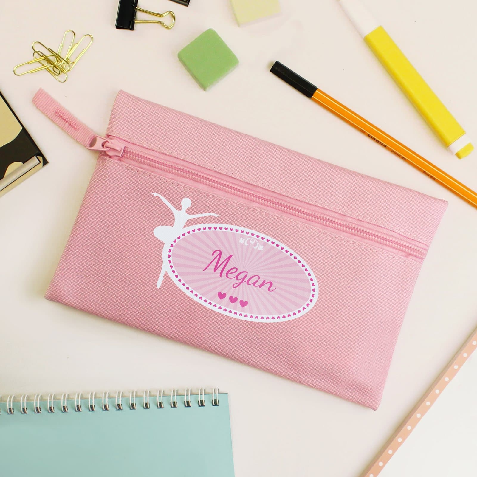 Pink microfibre pencil case with a zip, personalised with a name