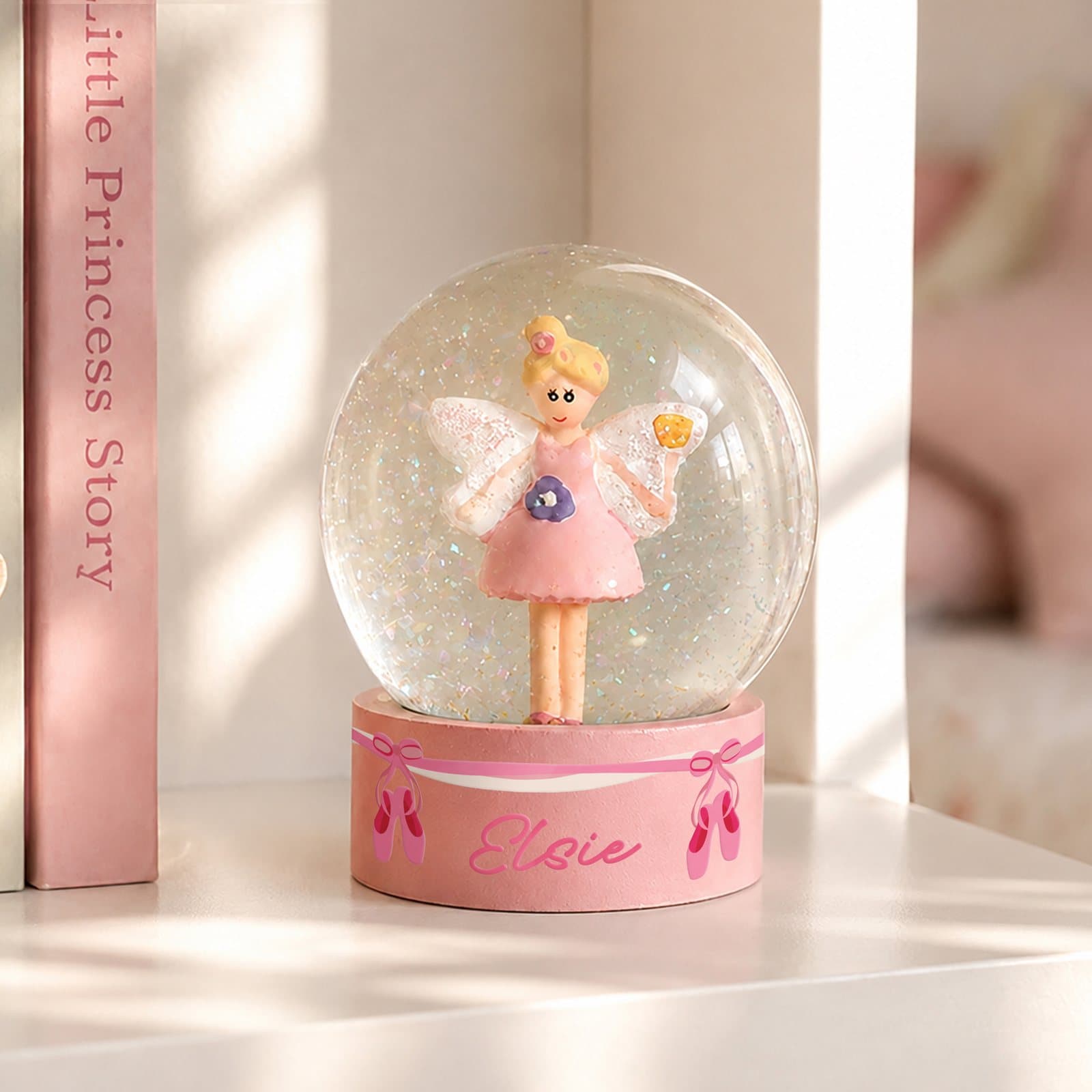 Ornamental fairy snow globe with ballet shoes design in resin and glass