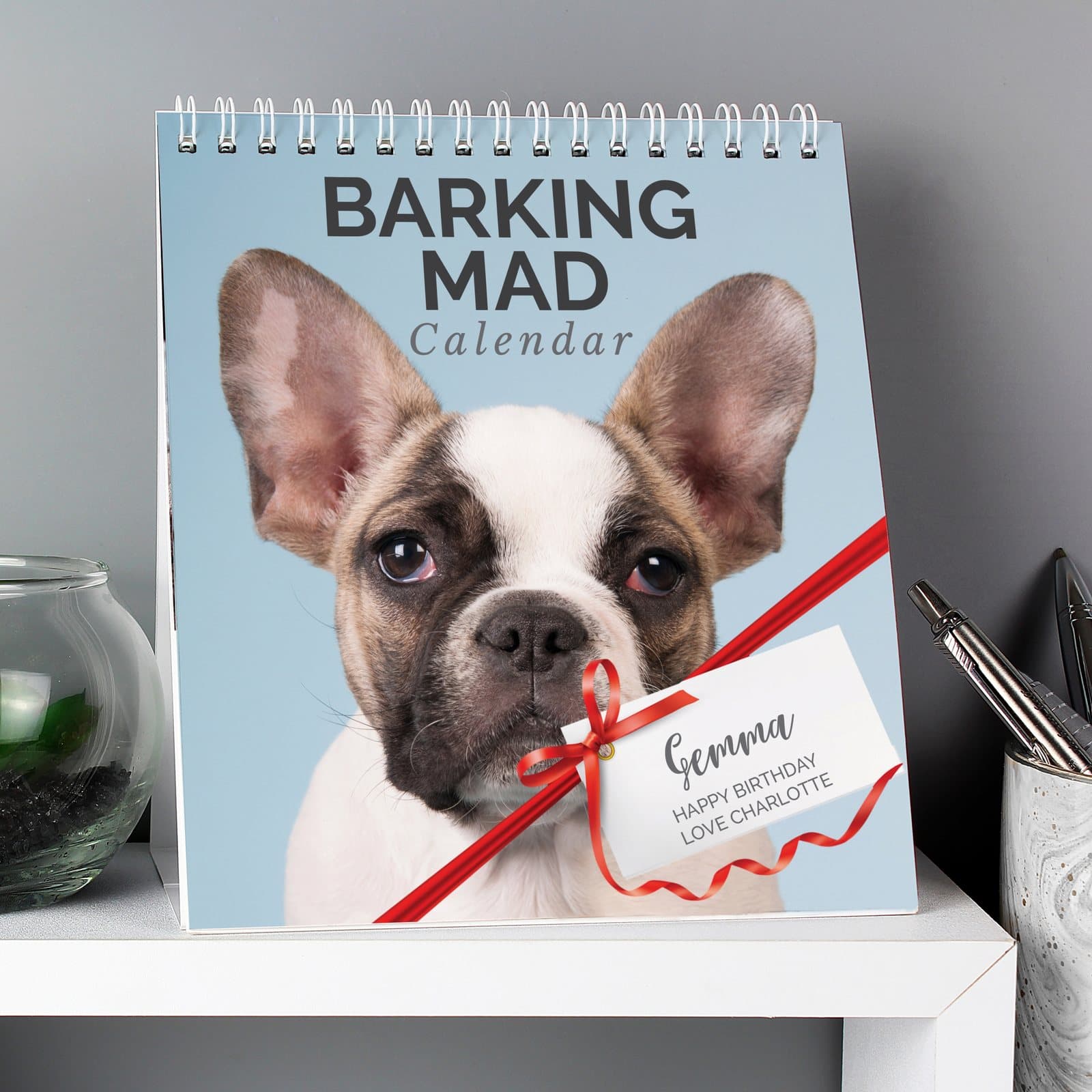 Personalised Barking Mad dog desk calendar showing the front cover with a name