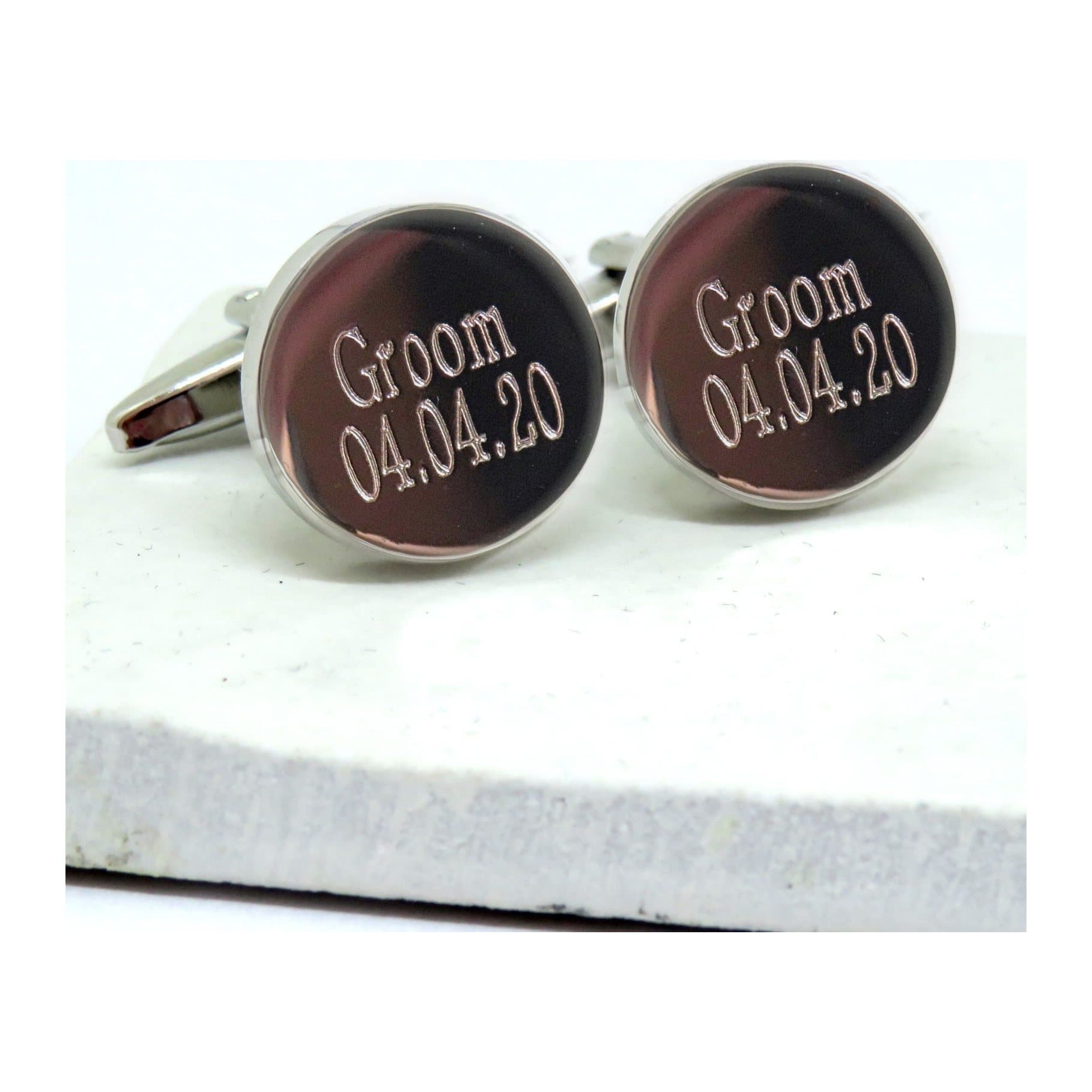 Round silver coloured personalised cufflinks for a groom, engraved with a name