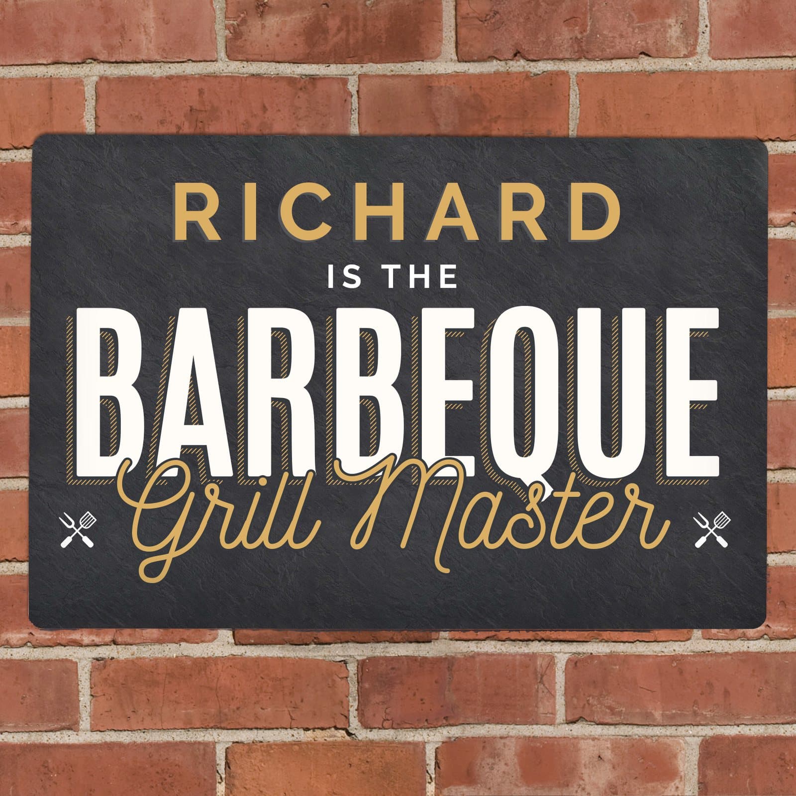 Aluminium sign reading a name and Is the barbeque grill master