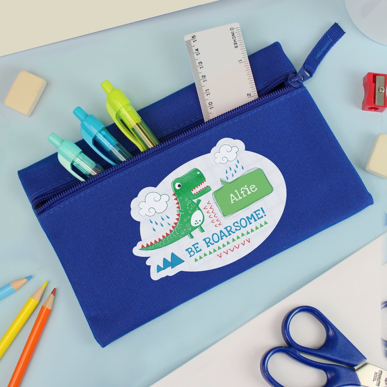 Blue dinosaur pencil case with Be Roarsome text and a first name