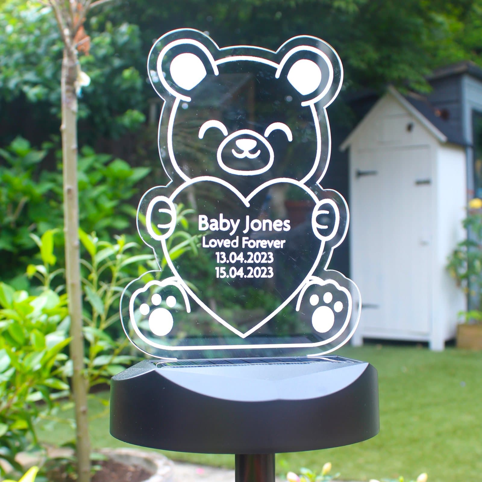 Bear shaped solar LED light with a personalised sign on a ground stick