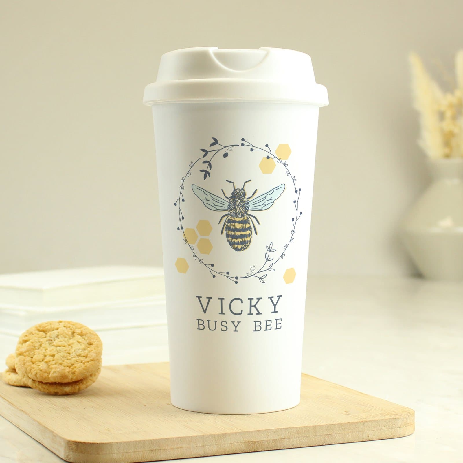 Bee design insulated travel cup with screw-on lid and two lines of text