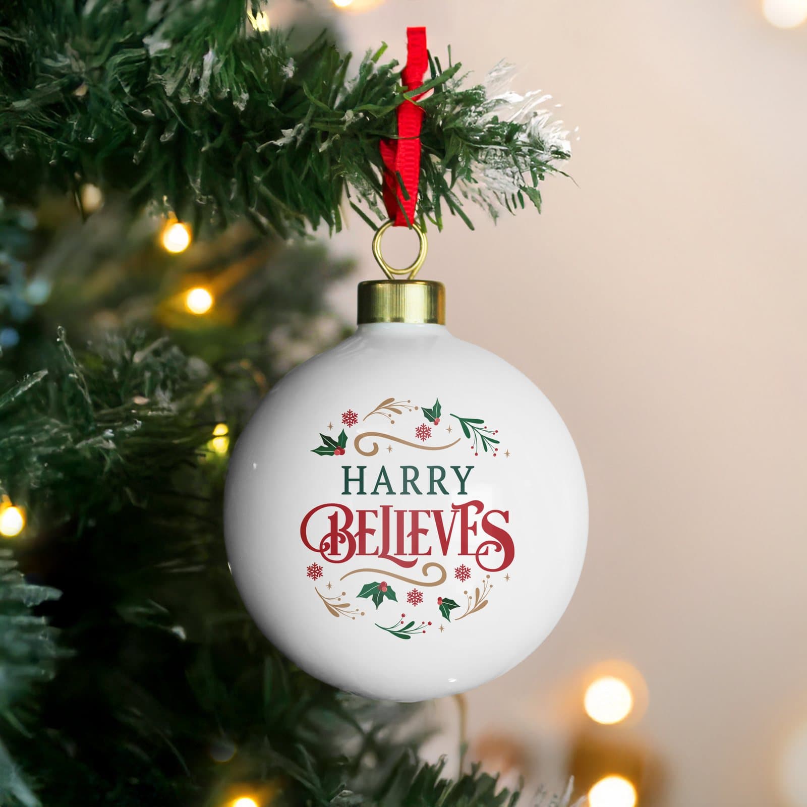 Believe in Christmas bauble with a personalised name and ribbon