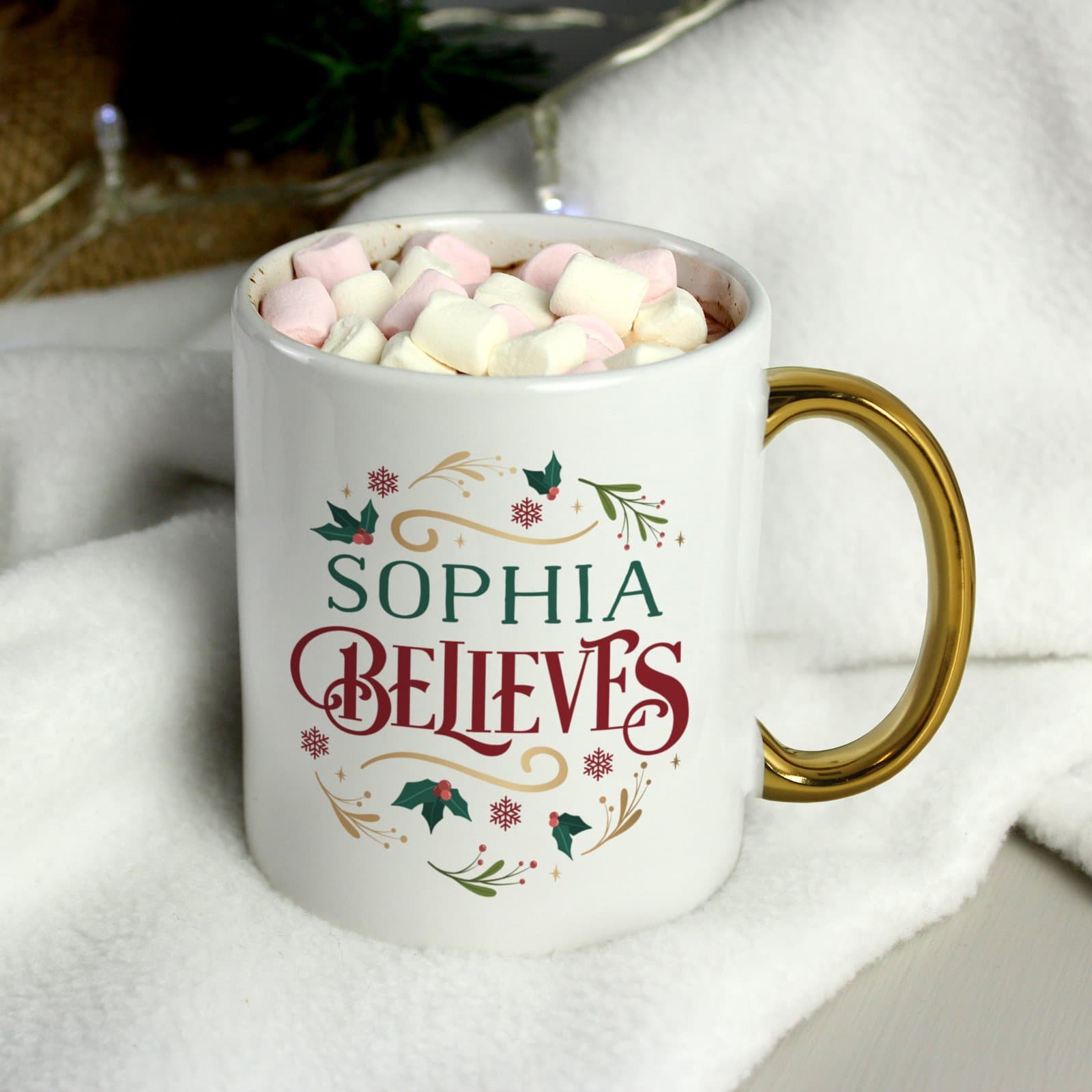 Christmas mug with a gold handle and a festive design