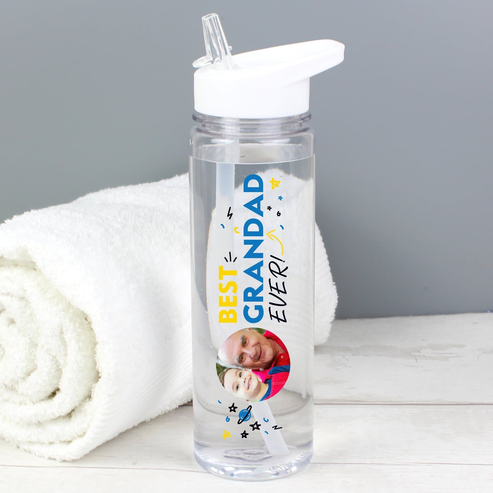 White-lidded water bottle with a photo and a Best Ever title