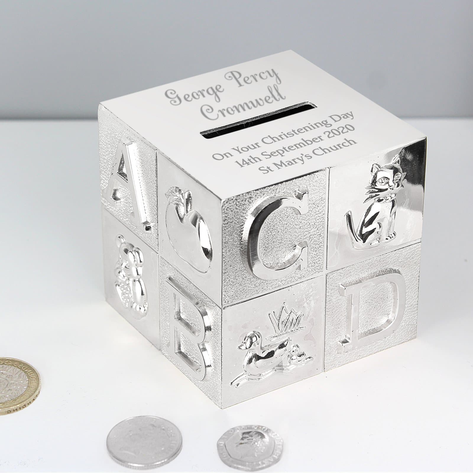 Personalised ABC money box engraved with a message and a money slot