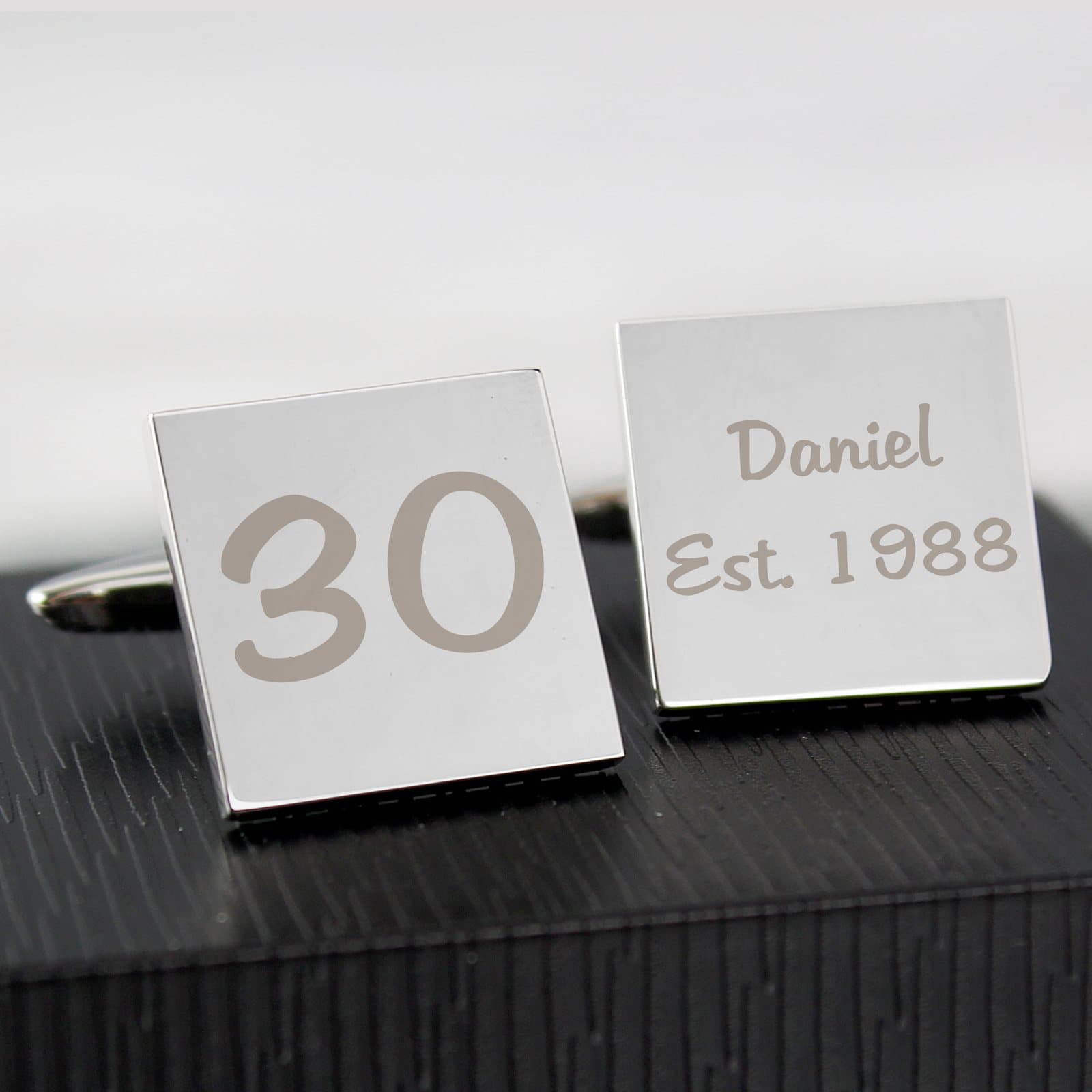 Pair of birthday cufflinks, one showing an age number