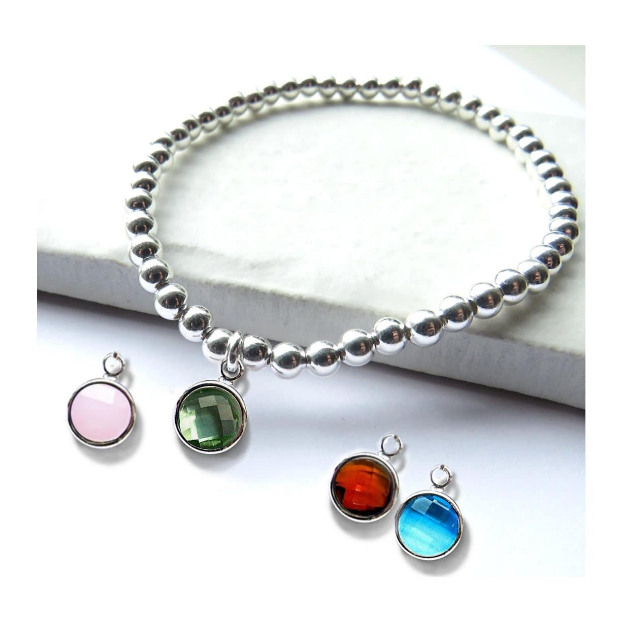 Silver beaded stretch bracelet with a coloured birthstone charm