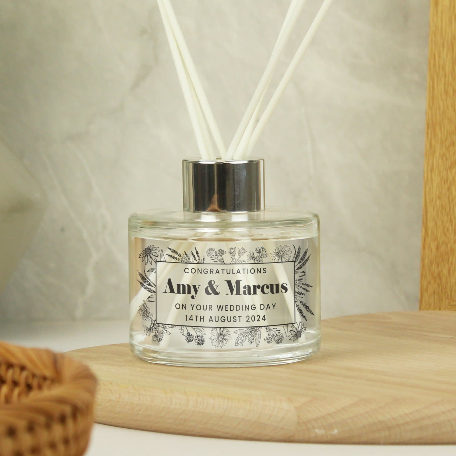 Personalised black foliage reed diffuser in glass with four lines of text