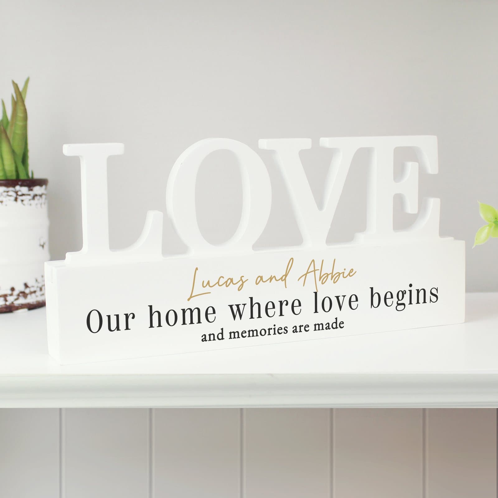 Black and gold wooden LOVE word plaque with three lines of personalised text