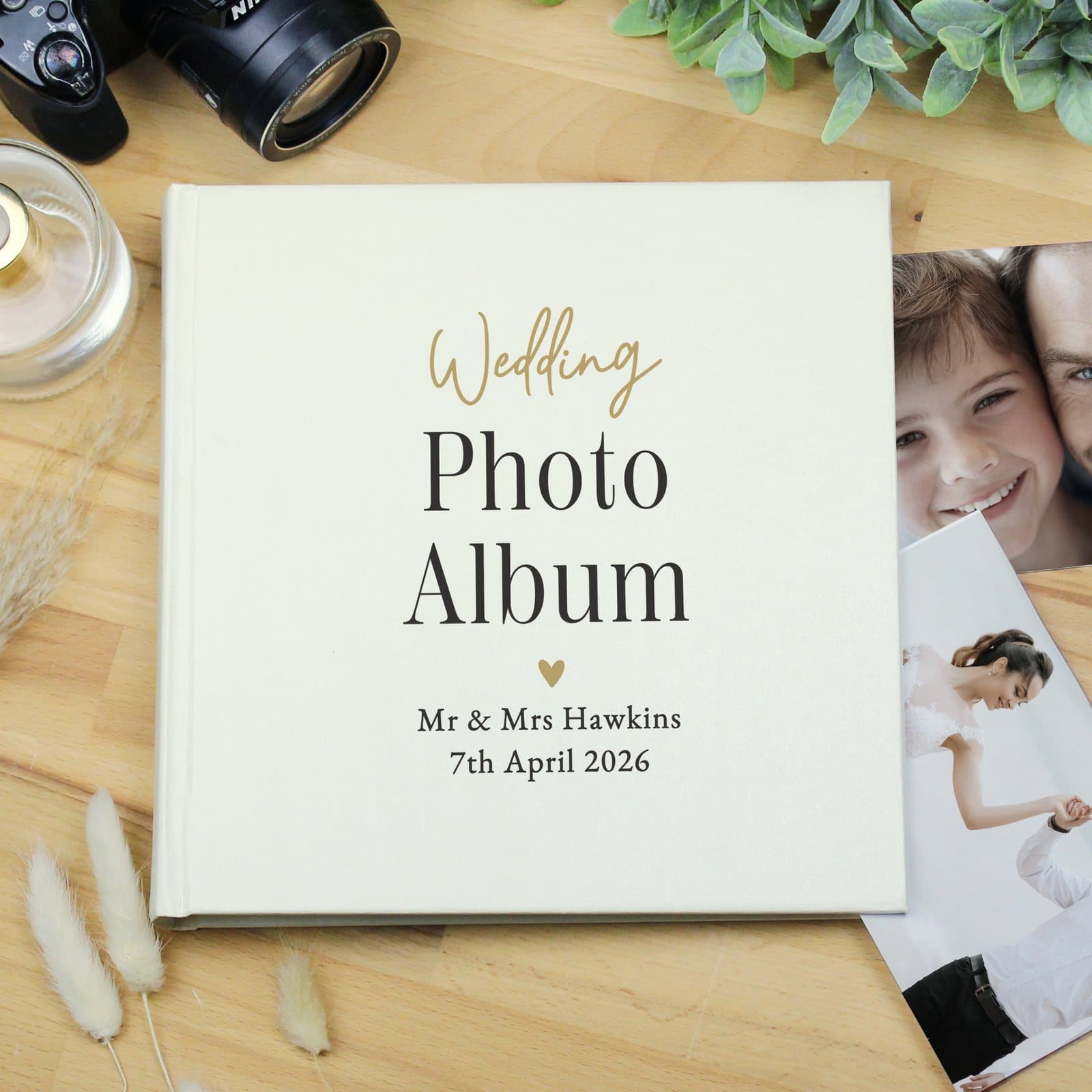Black and gold square photo album with personalised cover text
