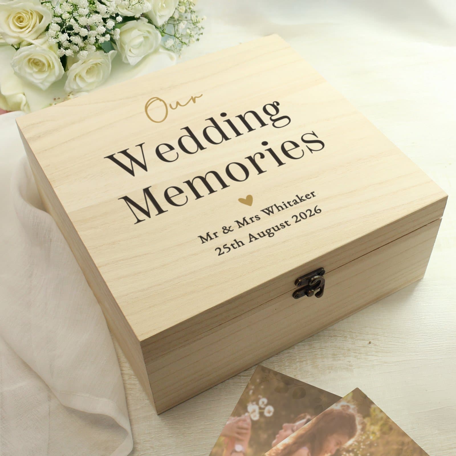 Black and gold wooden keepsake box with metal clasp and personalised text