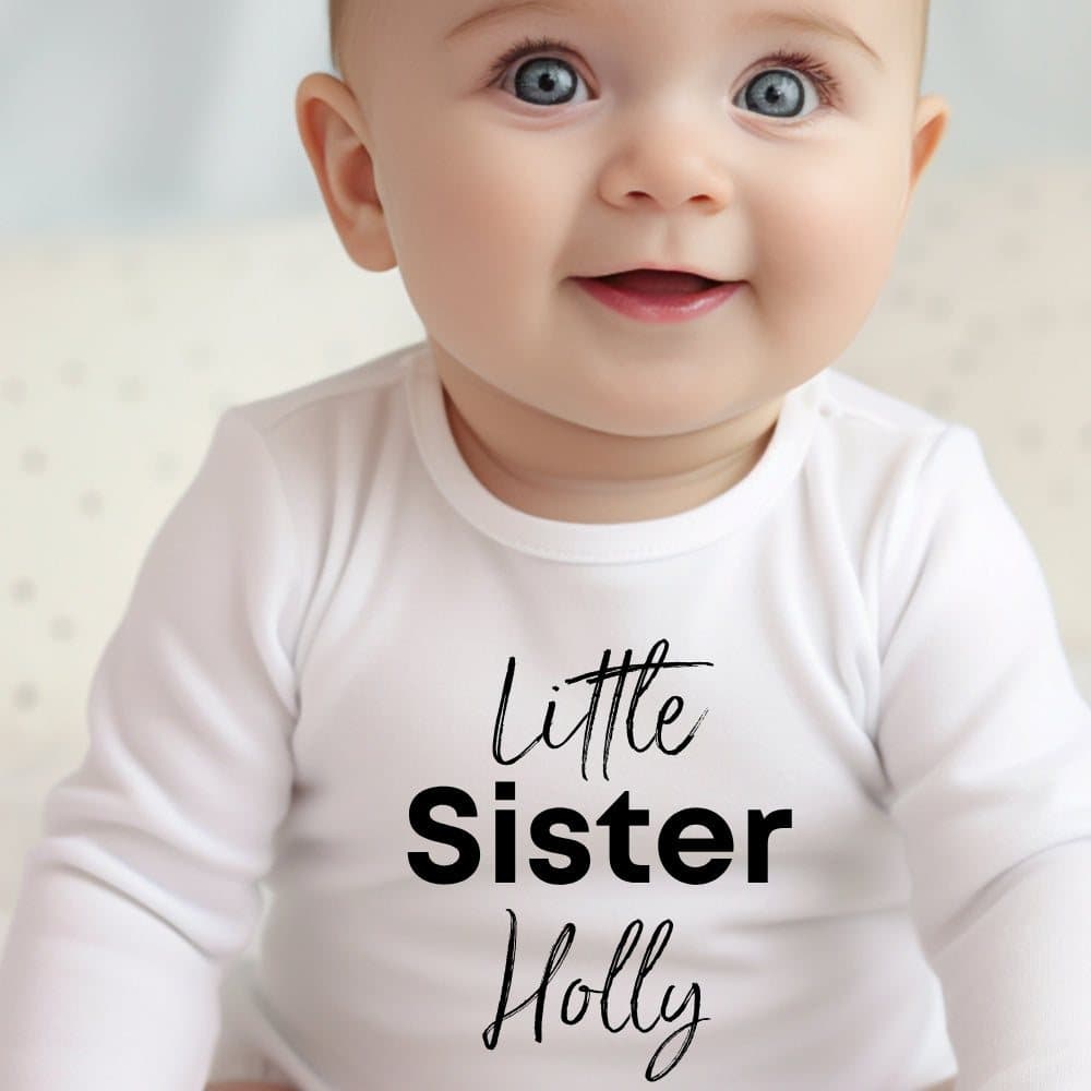 Black Little Sister artwork on a personalised baby grow, vest or bib with name lines