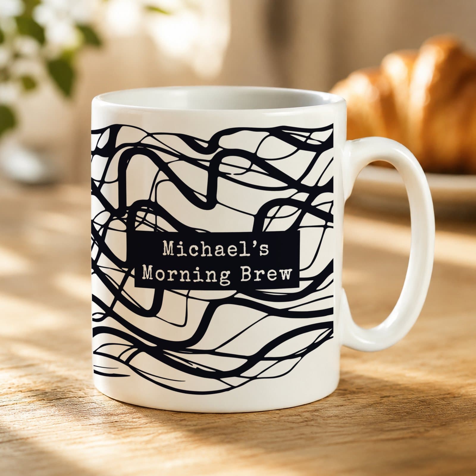 Personalised black ceramic mug with a bold wave design