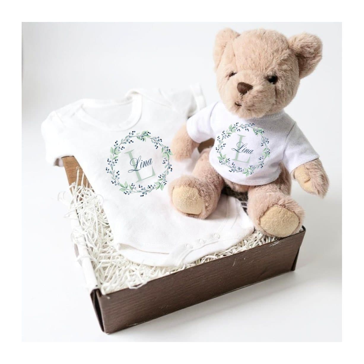 Blue and green floral personalised baby gift box with a teddy and a baby vest