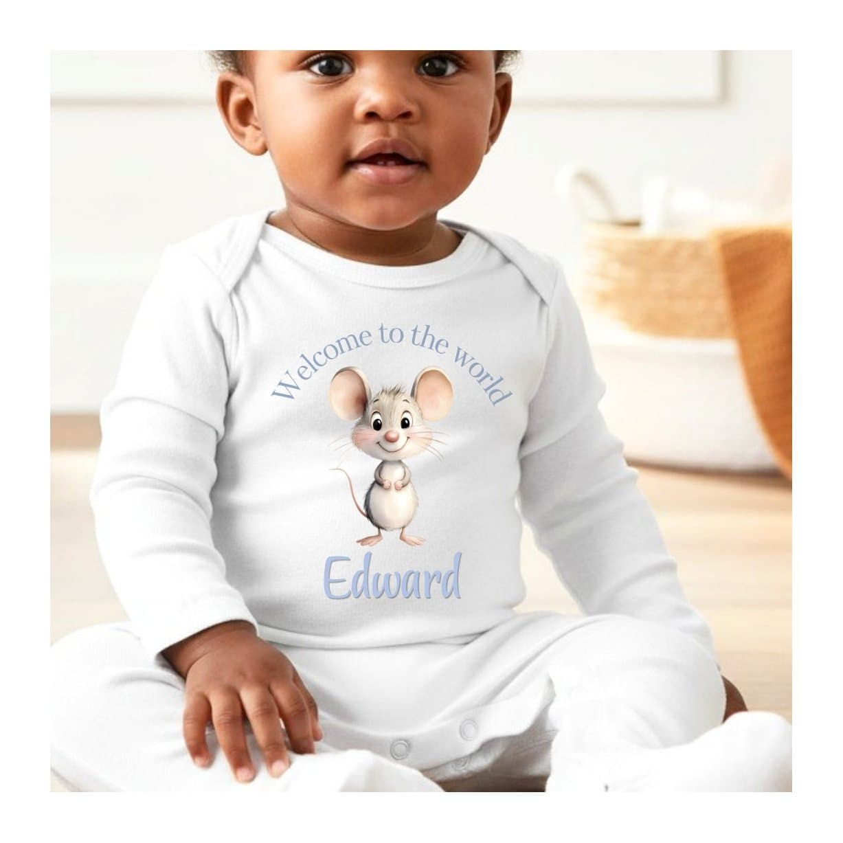Personalised blue mouse baby outfit with a name on the design