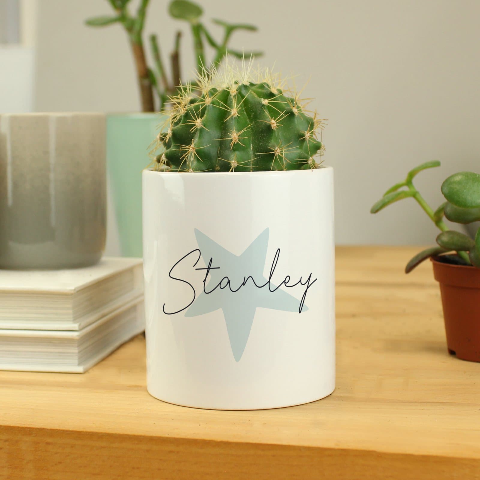 Blue star ceramic storage pot with a name in script font
