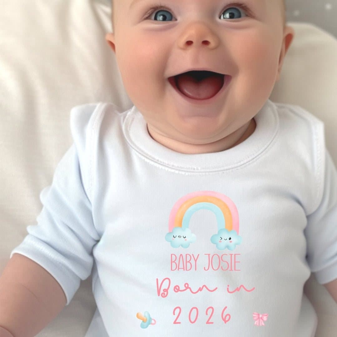 Baby grow with a Born in 2026 design, a pretty rainbow and space for a name