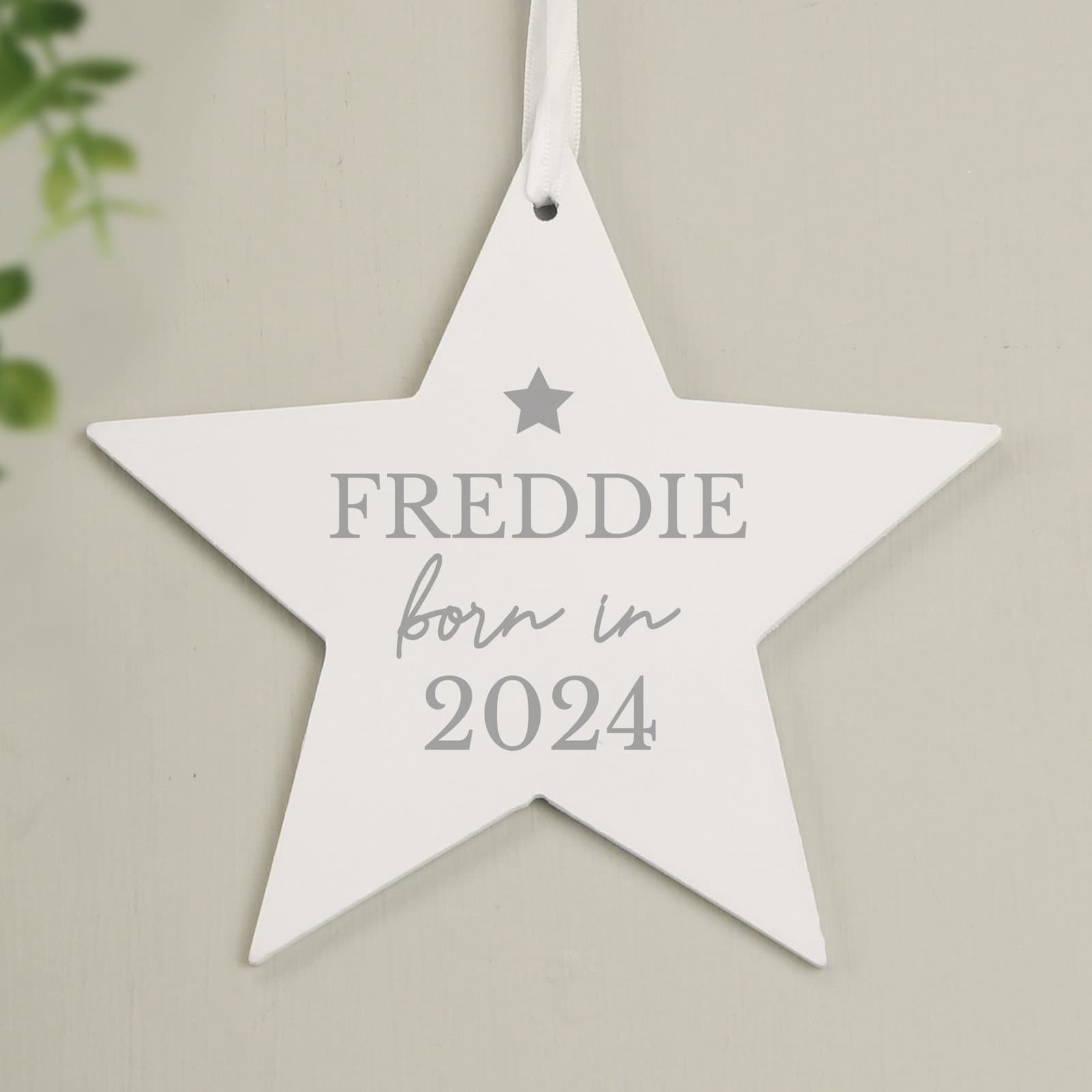 Wooden star decoration with ribbon, personalised with Born in, a name and a year