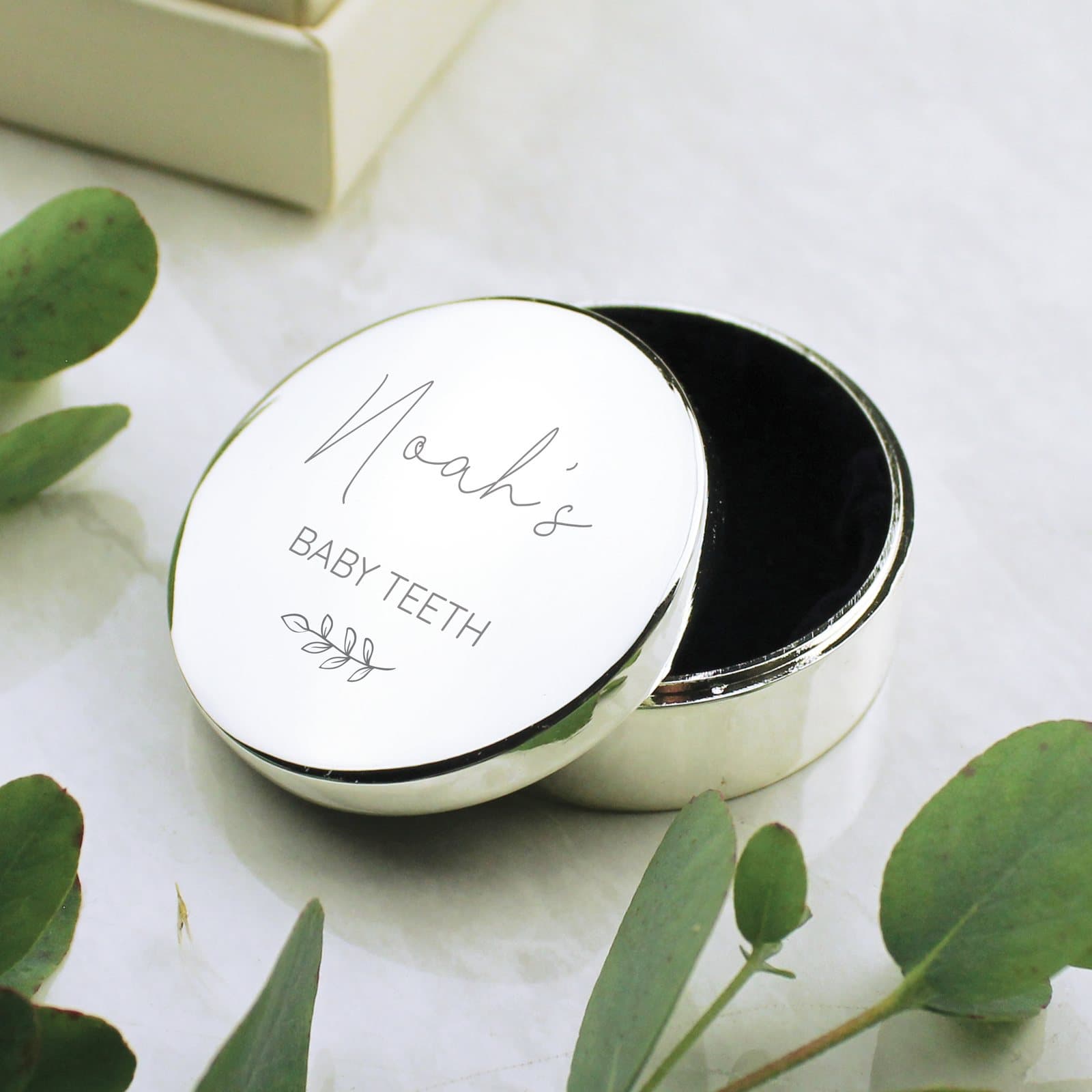 Round personalised botanical trinket box for a baby's first tooth or curl