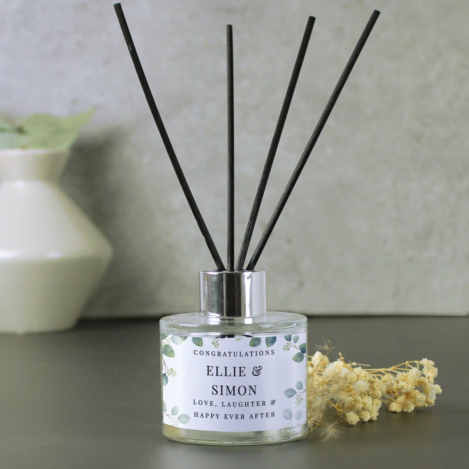Personalised botanical glass reed diffuser with five lines of text