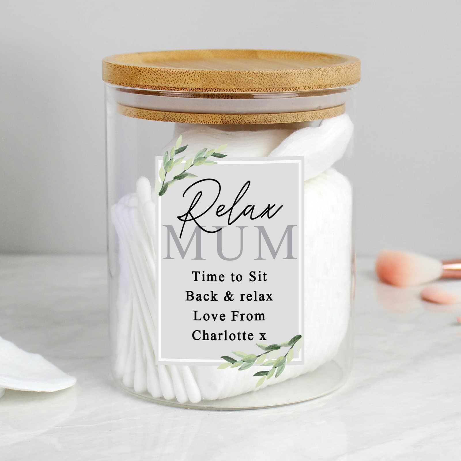 Personalised botanical glass jar with a bamboo lid