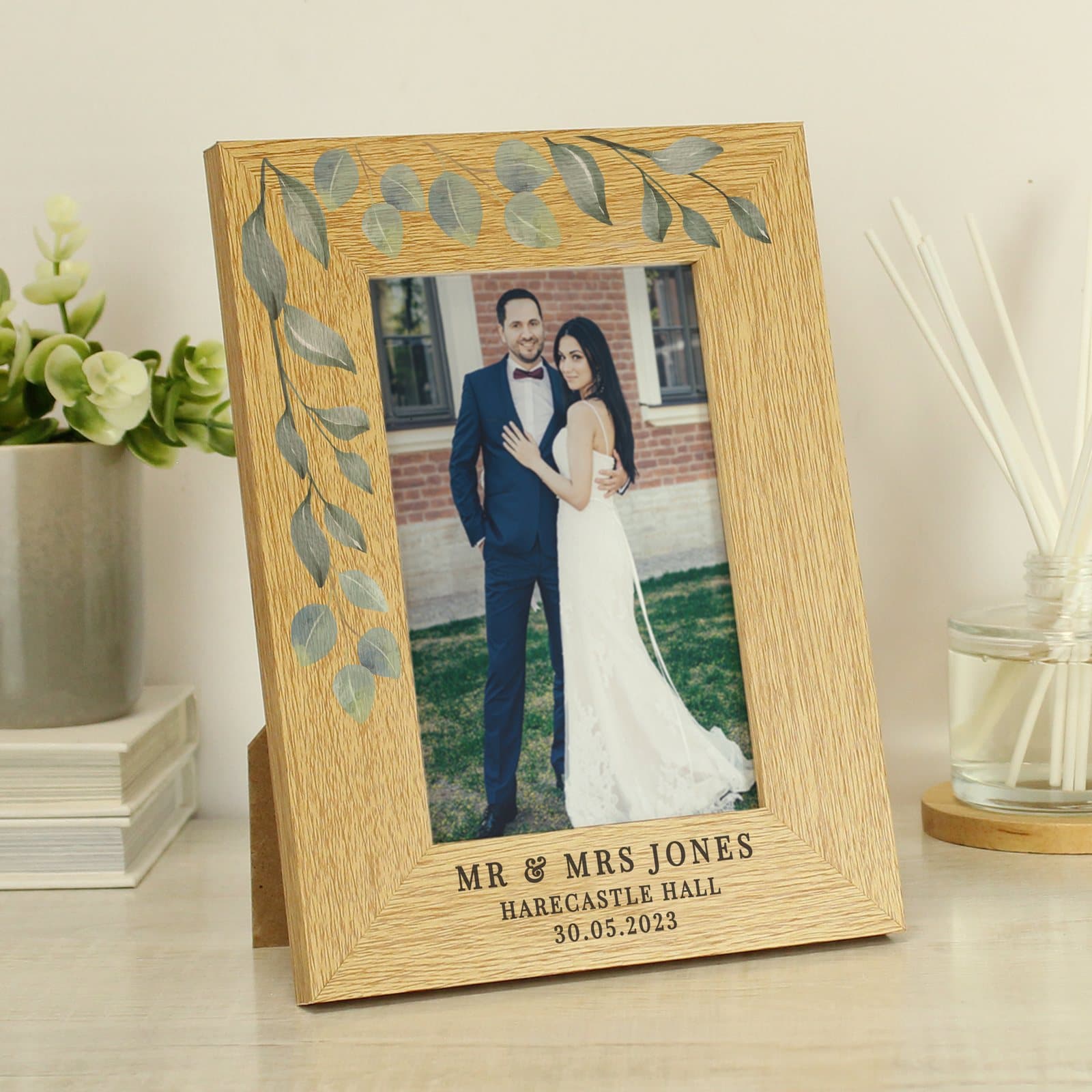 Oak veneer botanical photo frame with three lines of personalised text