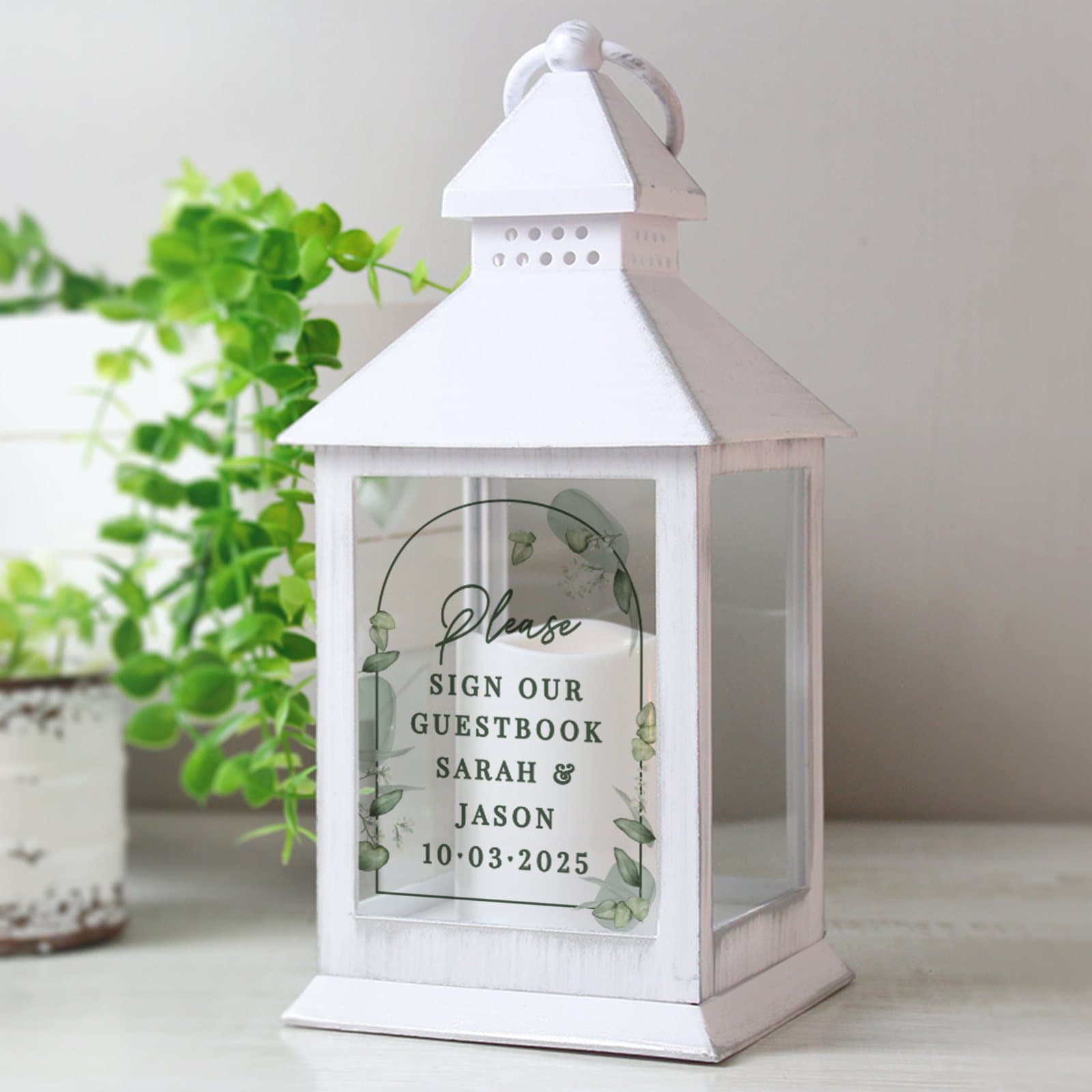 White botanical wedding lantern with a flickering flame effect