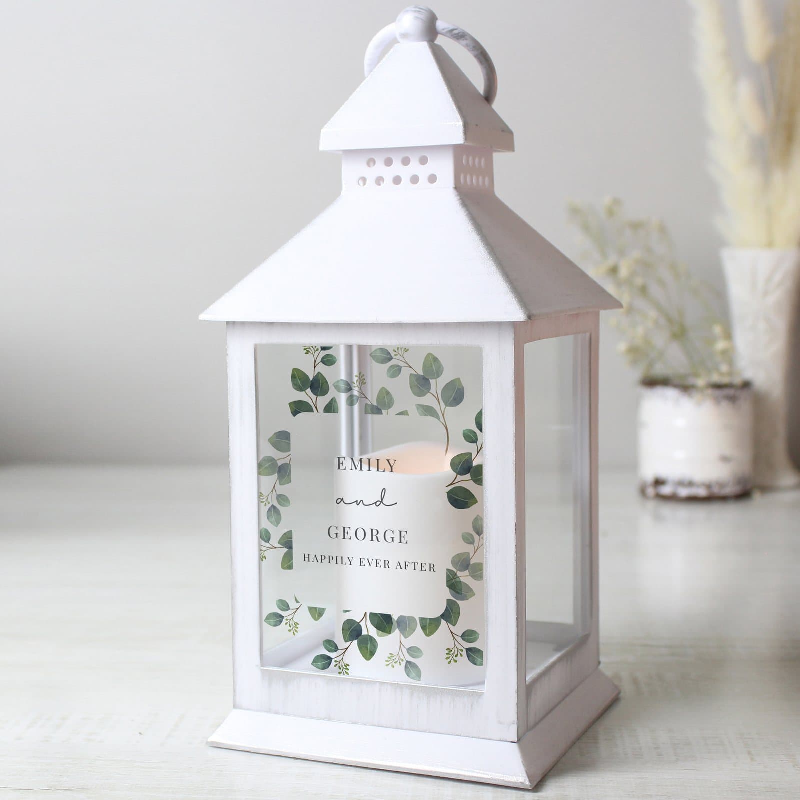 White botanical lantern with four lines of text and a warm flame effect