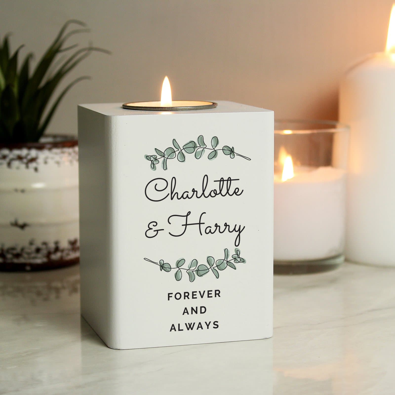 White painted wooden tea light holder with five lines of text