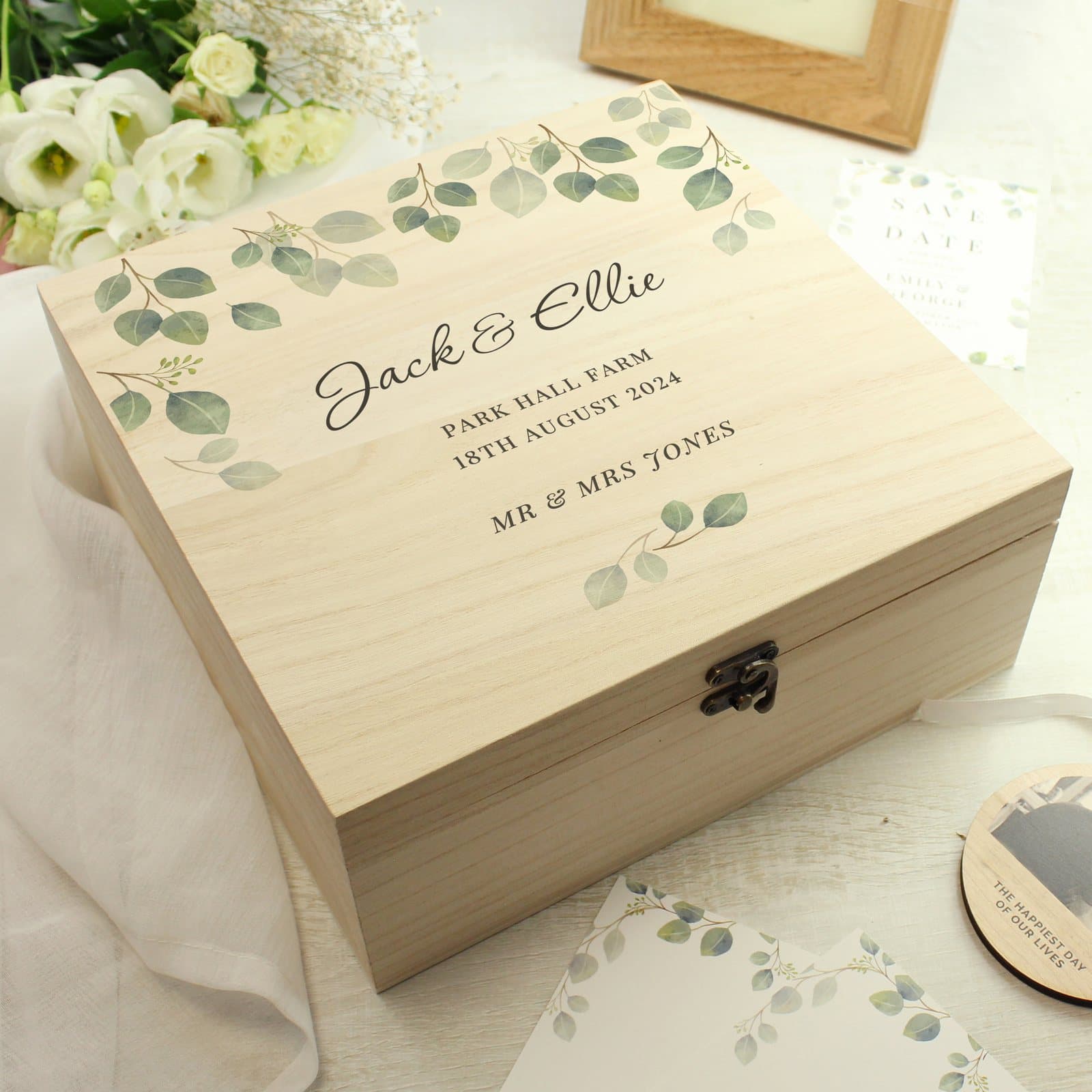 Wooden keepsake box with a botanical design and a metal clasp