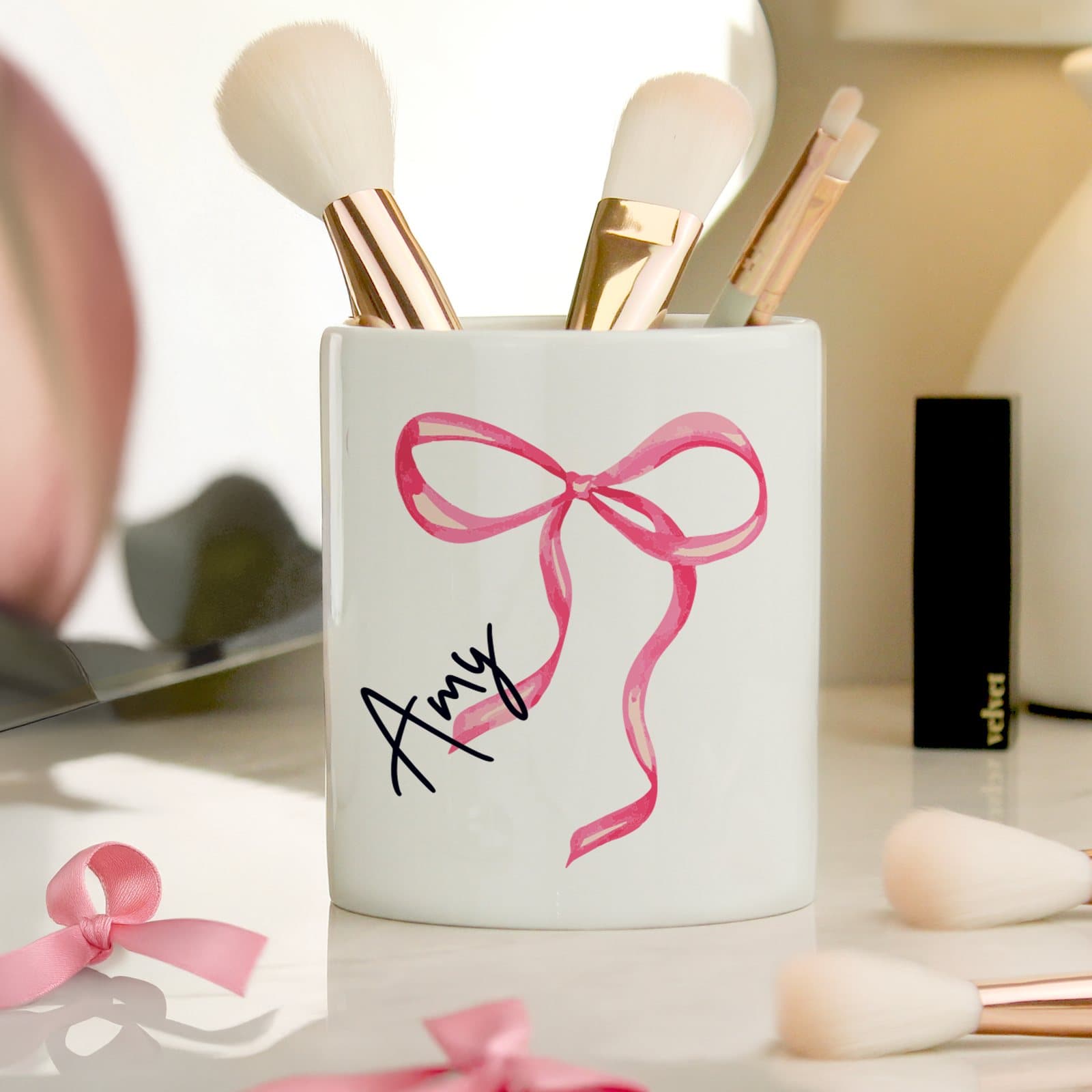 Ceramic make up brush holder with a bow design