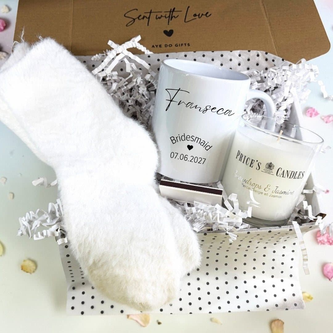 Personalised bridesmaid gift hamper with a mug, scented candle, fluffy socks and matches
