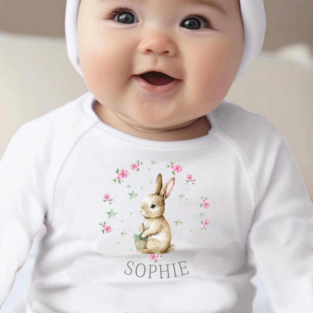 Baby outfit with a bunny and pink flowers design and a name