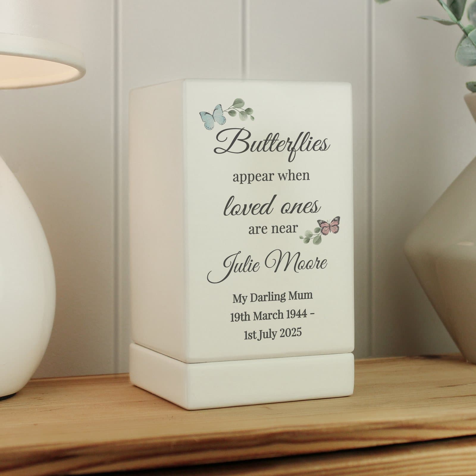 Small wooden urn with a butterfly design and personalised message