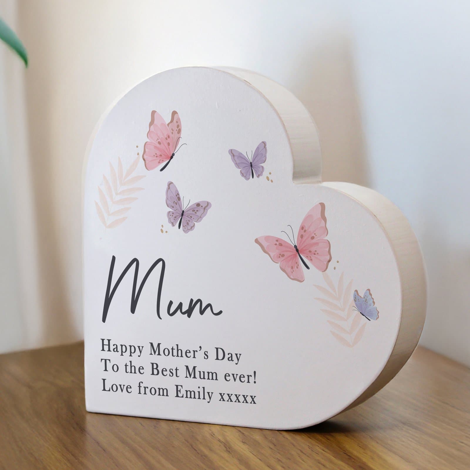 Grey wooden free standing heart ornament with a butterfly