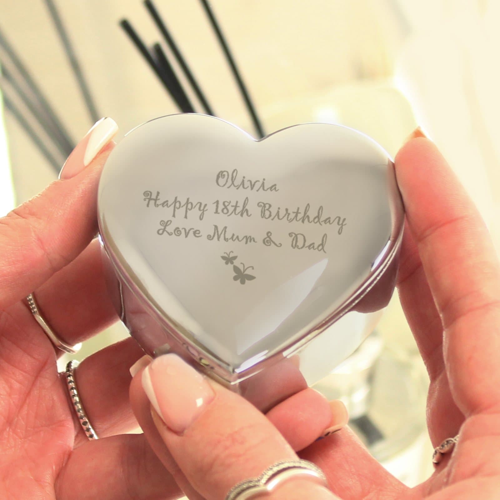 Nickel plated heart trinket box with a butterfly motif