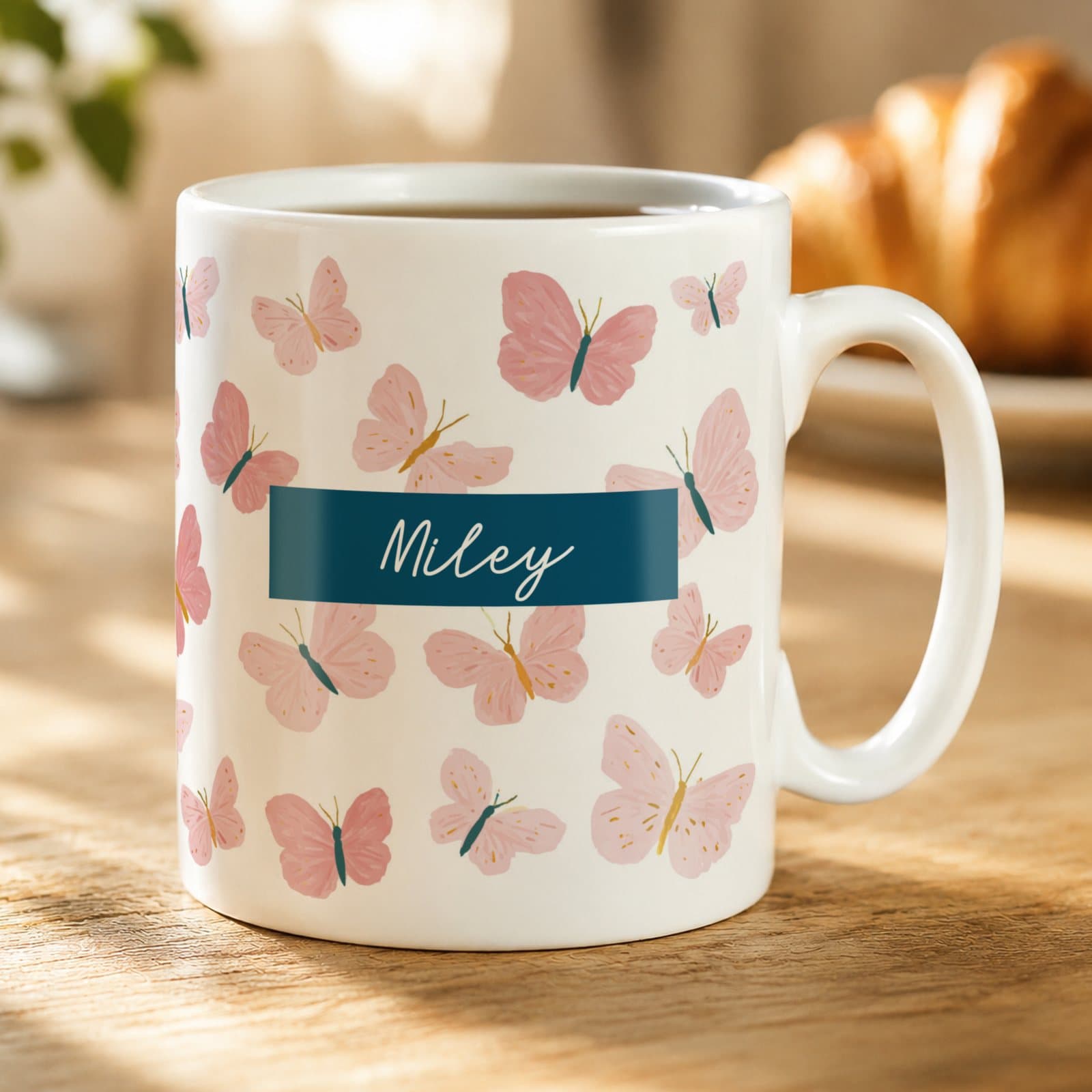 Ceramic mug with a butterfly design and a personalised name
