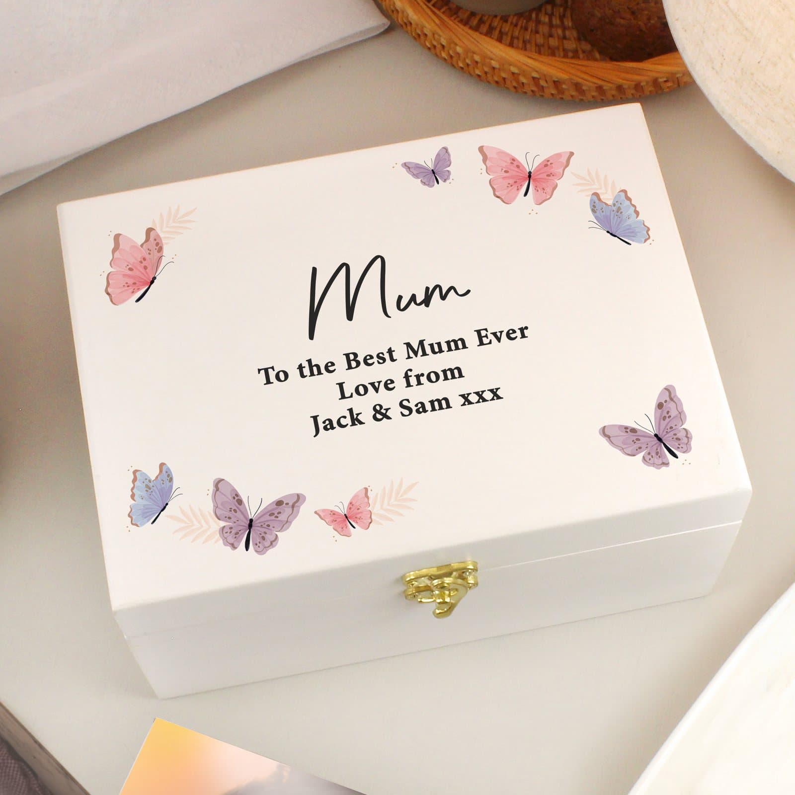 White hand painted wooden keepsake box with a butterfly design and metal clasp