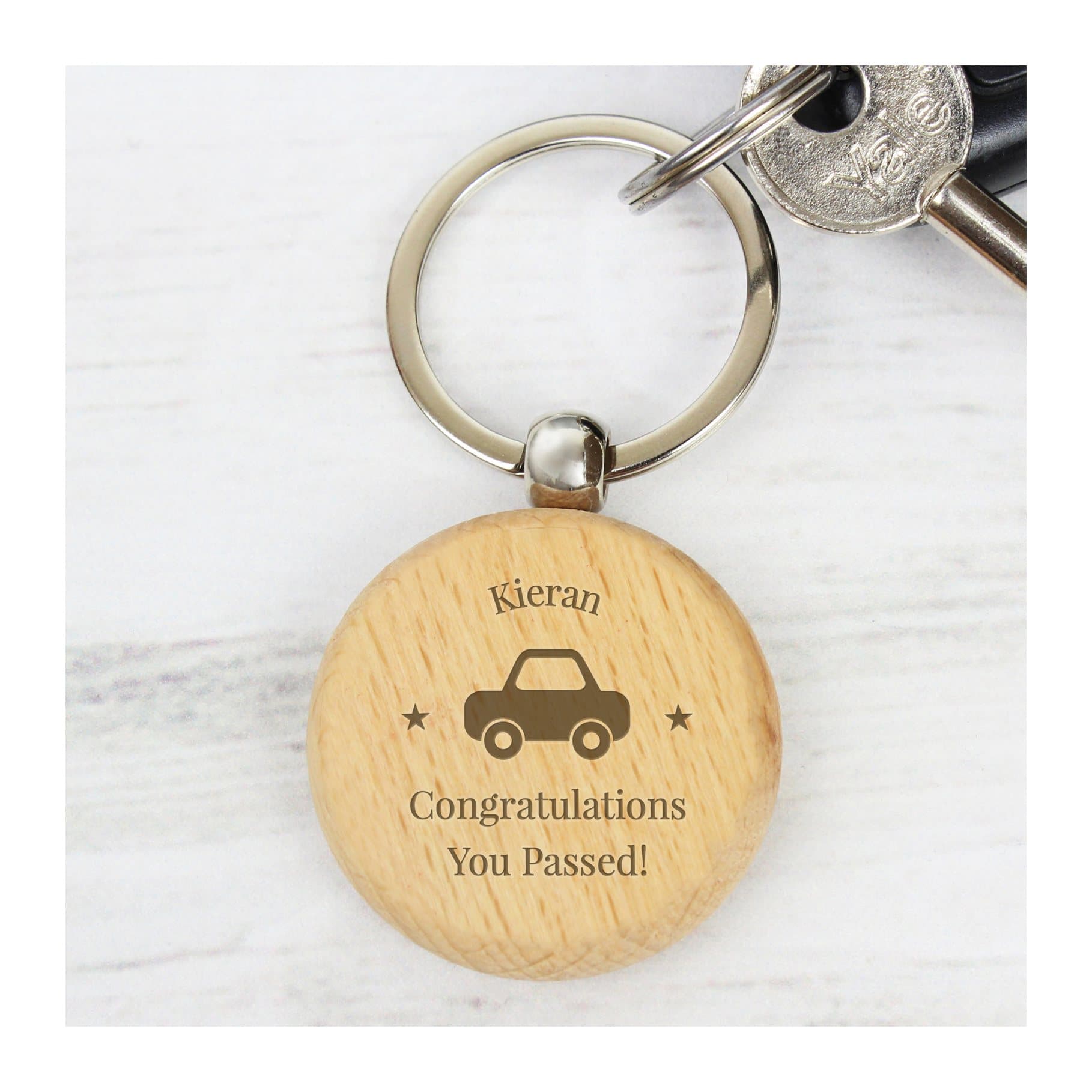 Solid beech wood keyring with a car motif and lines of text