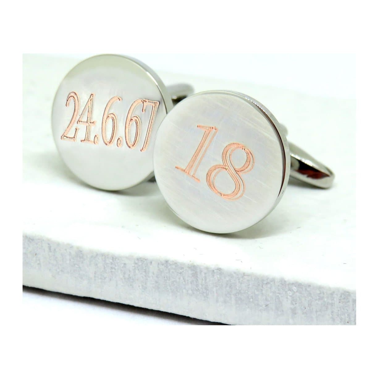 Round silver-coloured personalised cufflinks with a name engraved
