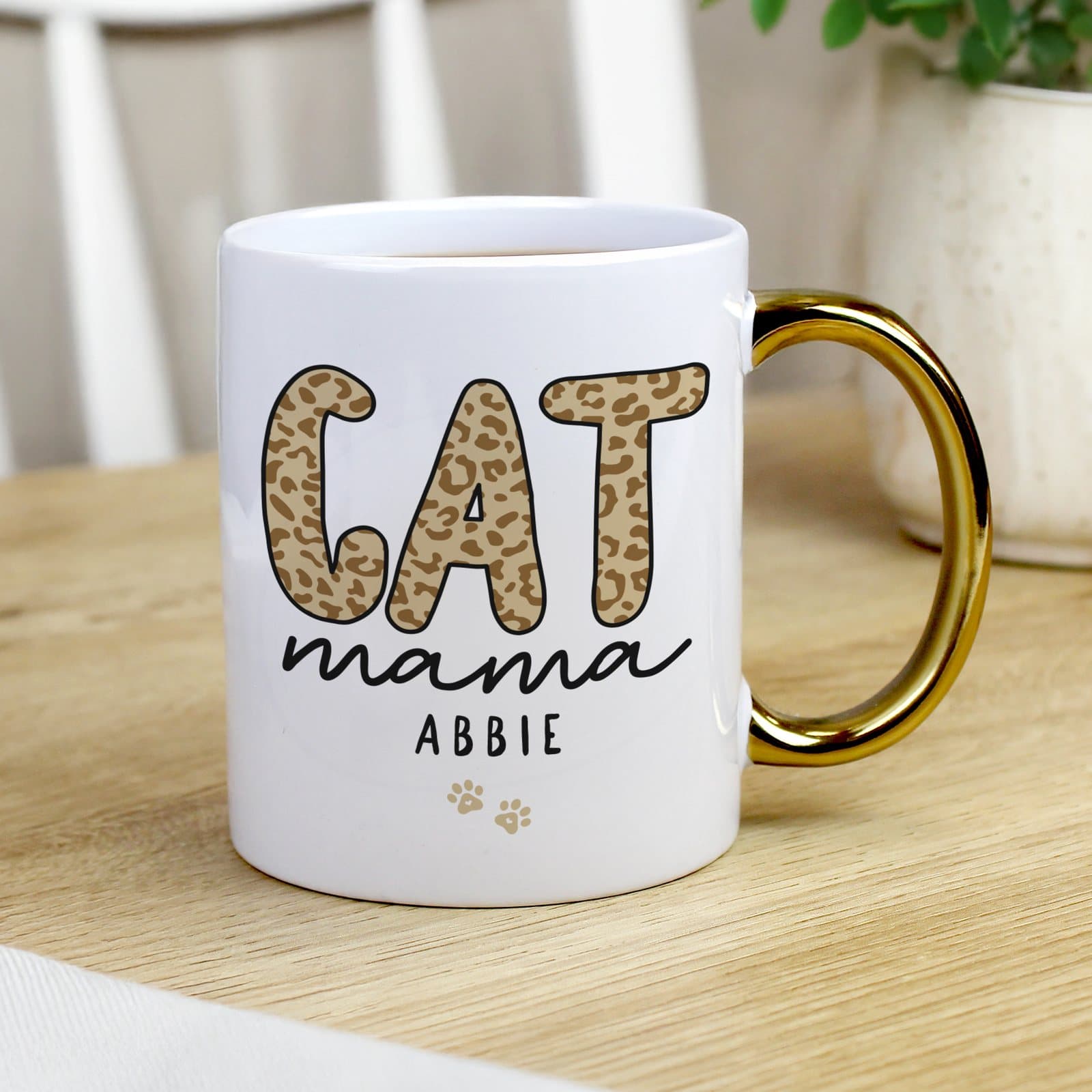 Ceramic cat mama mug with a gold handle