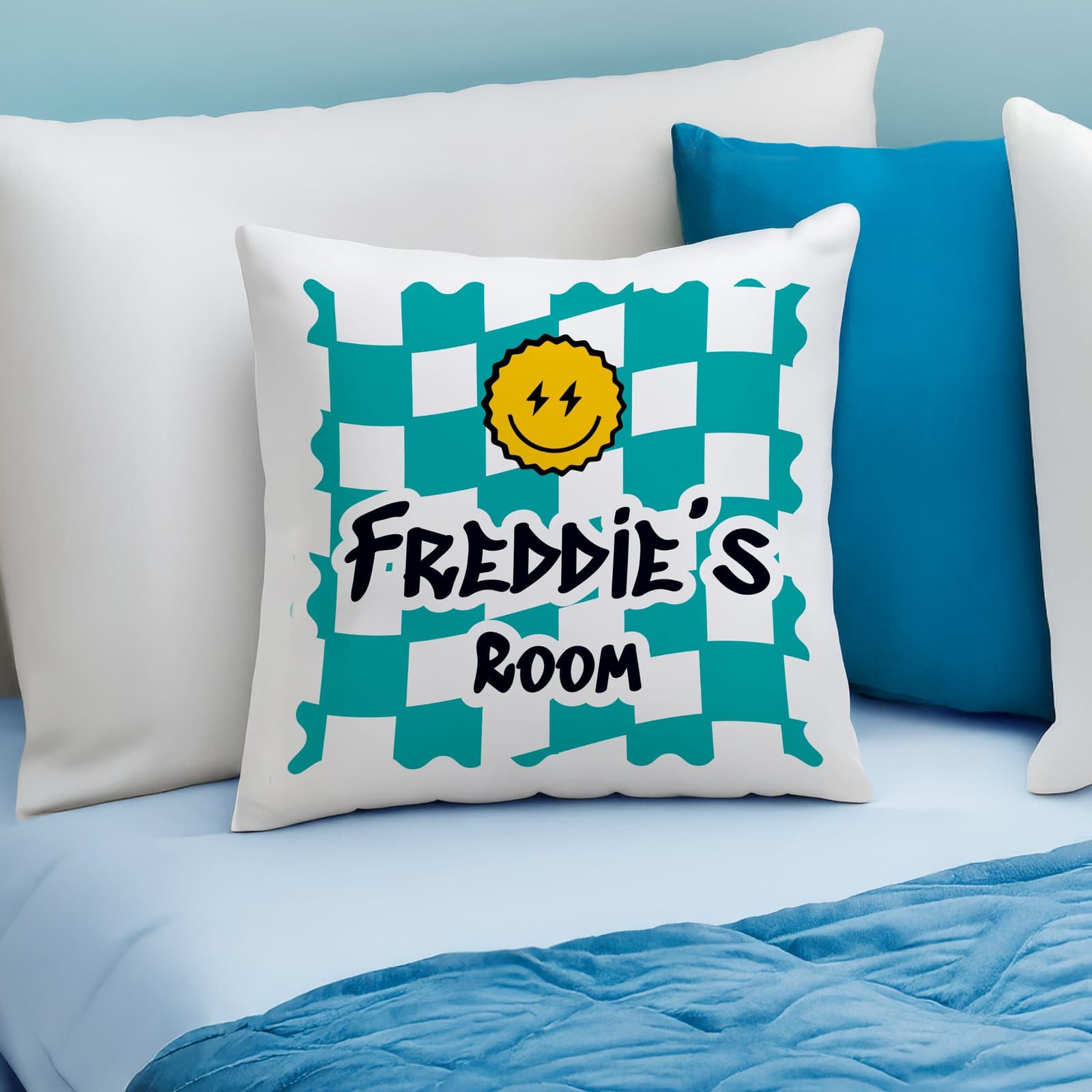 Checked children's bedroom cushion in blue or pink with two lines of personalised text