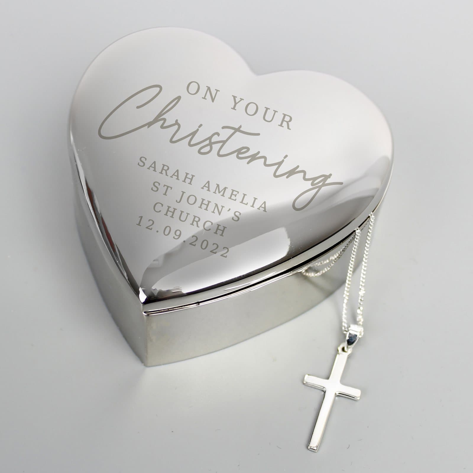 Heart trinket box with a cross necklace in an organza bag