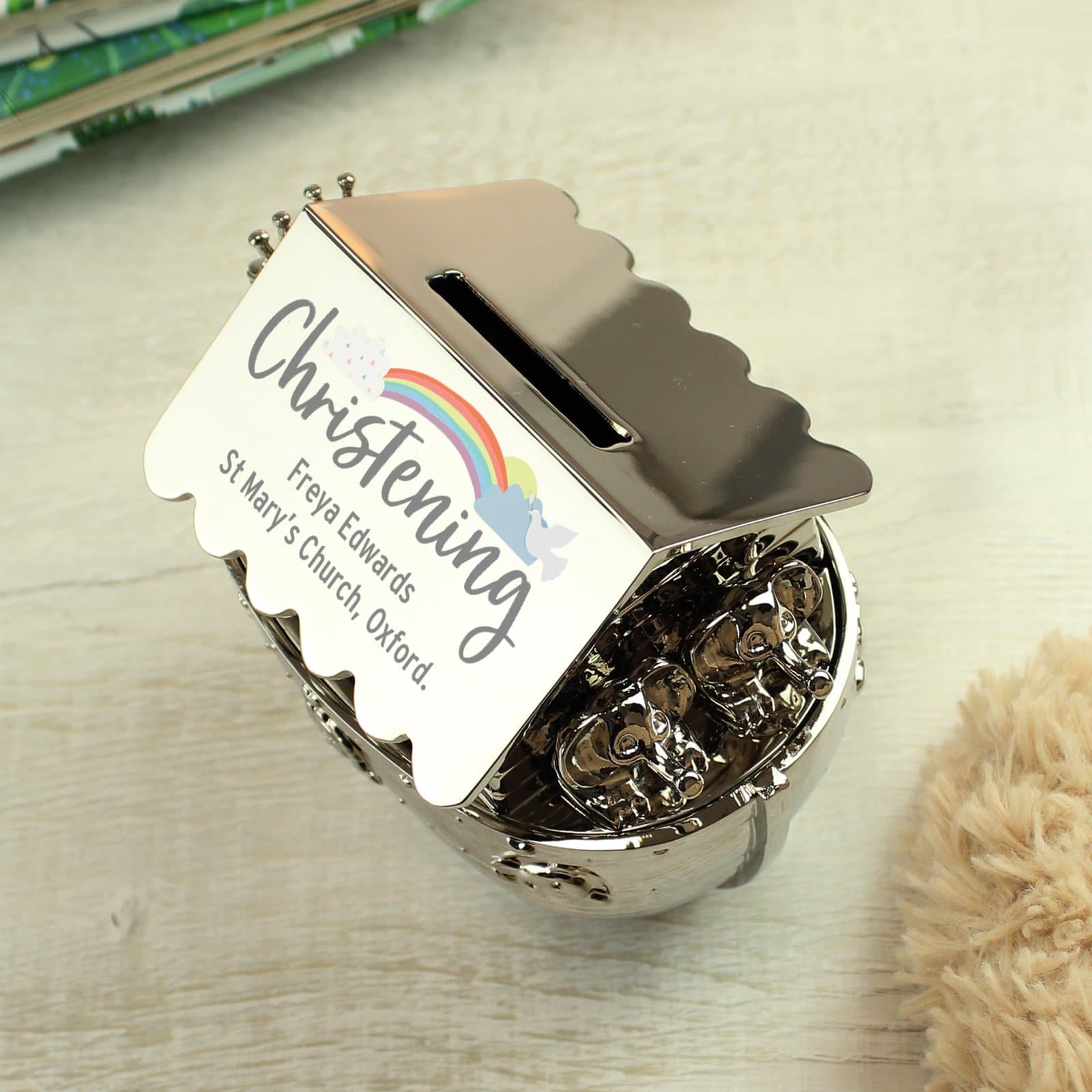 Silver finish Noah's ark money box with a colourful rainbow design