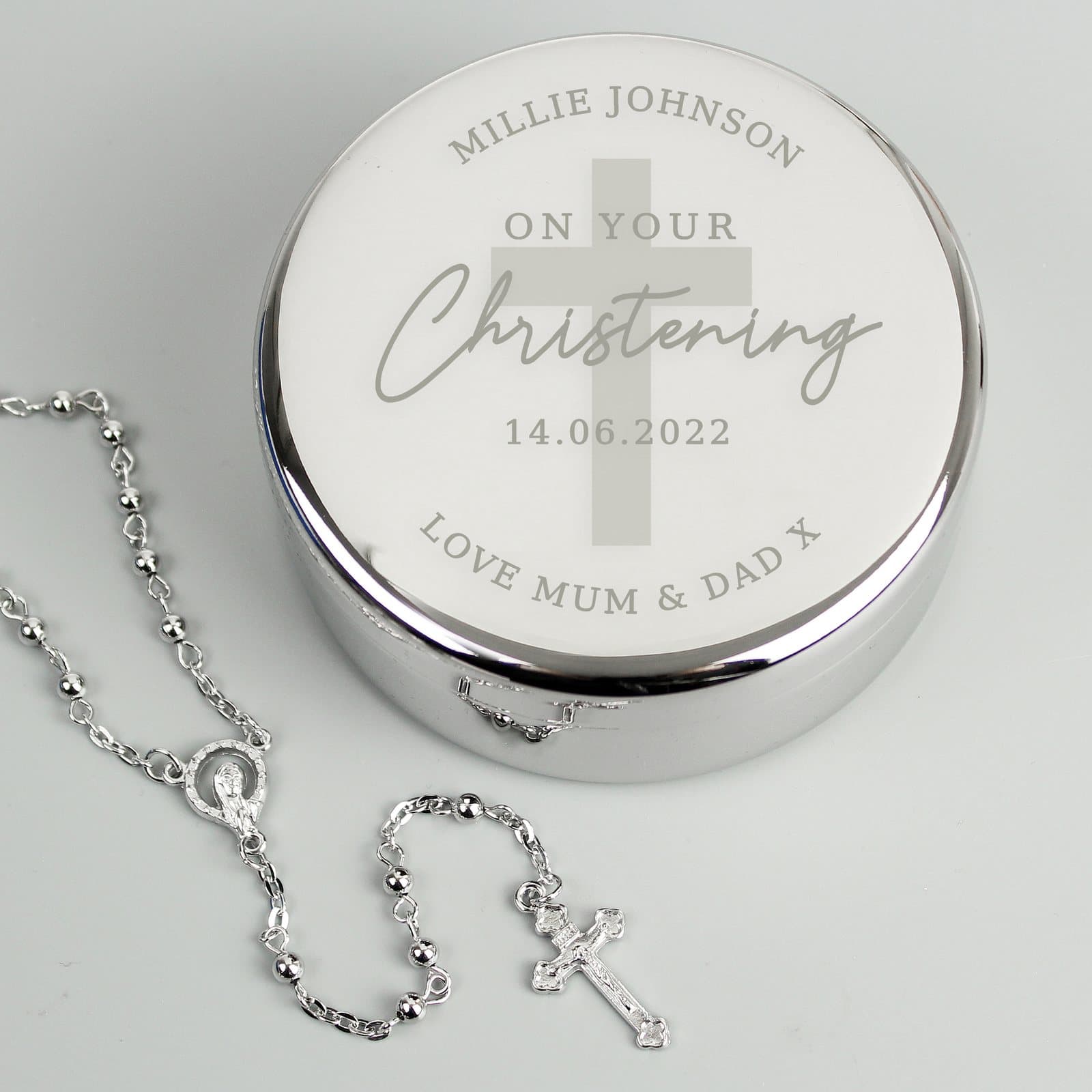 Round christening trinket box with rosary beads in an organza bag