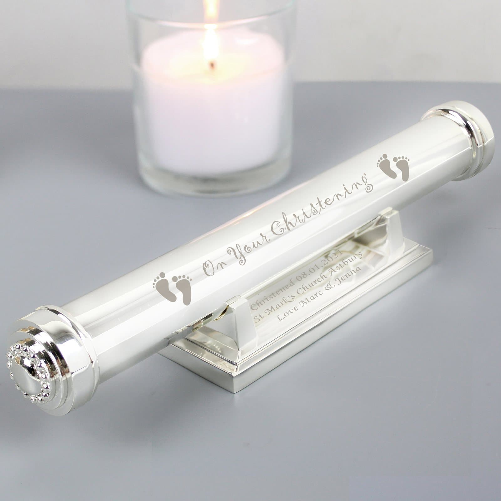 Silver plated christening certificate holder with a footprints motif